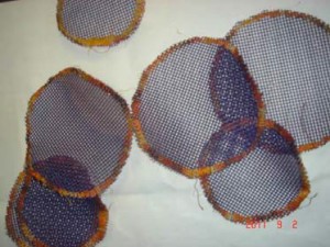 Purple plastic screen circles that were removed from the original 