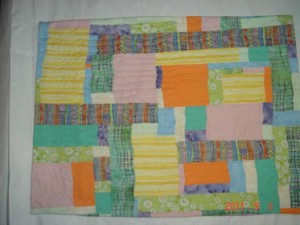 Yellow, orange, green quilt before 3D additions