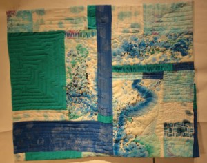 Full shot of the quilt showing the fianl layout with the beadwork and the final quilting