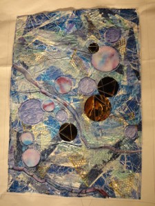  blue and purple paper quilt with gold cirles and openings