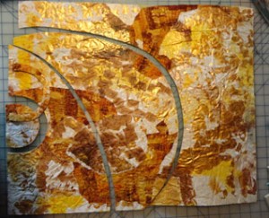 Paper quilt in gold , whiet and brown