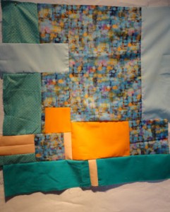 Turquoise, blue and orange squares in a top.