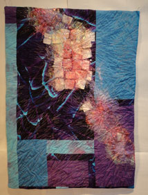 Blue Purple and red quilt with angleina stitched on top