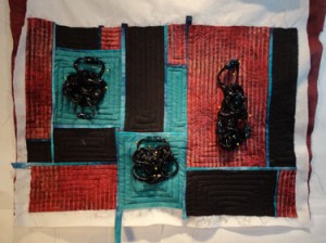   Full shot of quilt with DMC colors/fabric and black knots on top