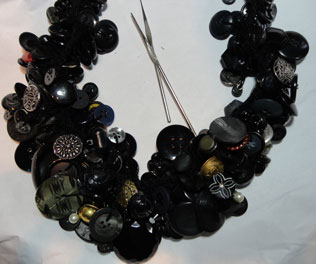 Finished necklace in black buttons
