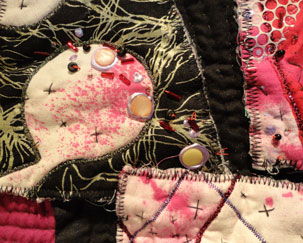 Detail of the Xed stitches and part of the bead work