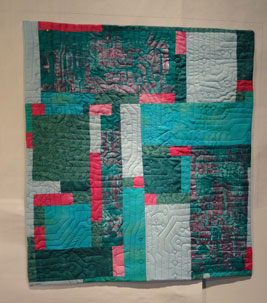 Full shot of the turquoise and fusha quilt 